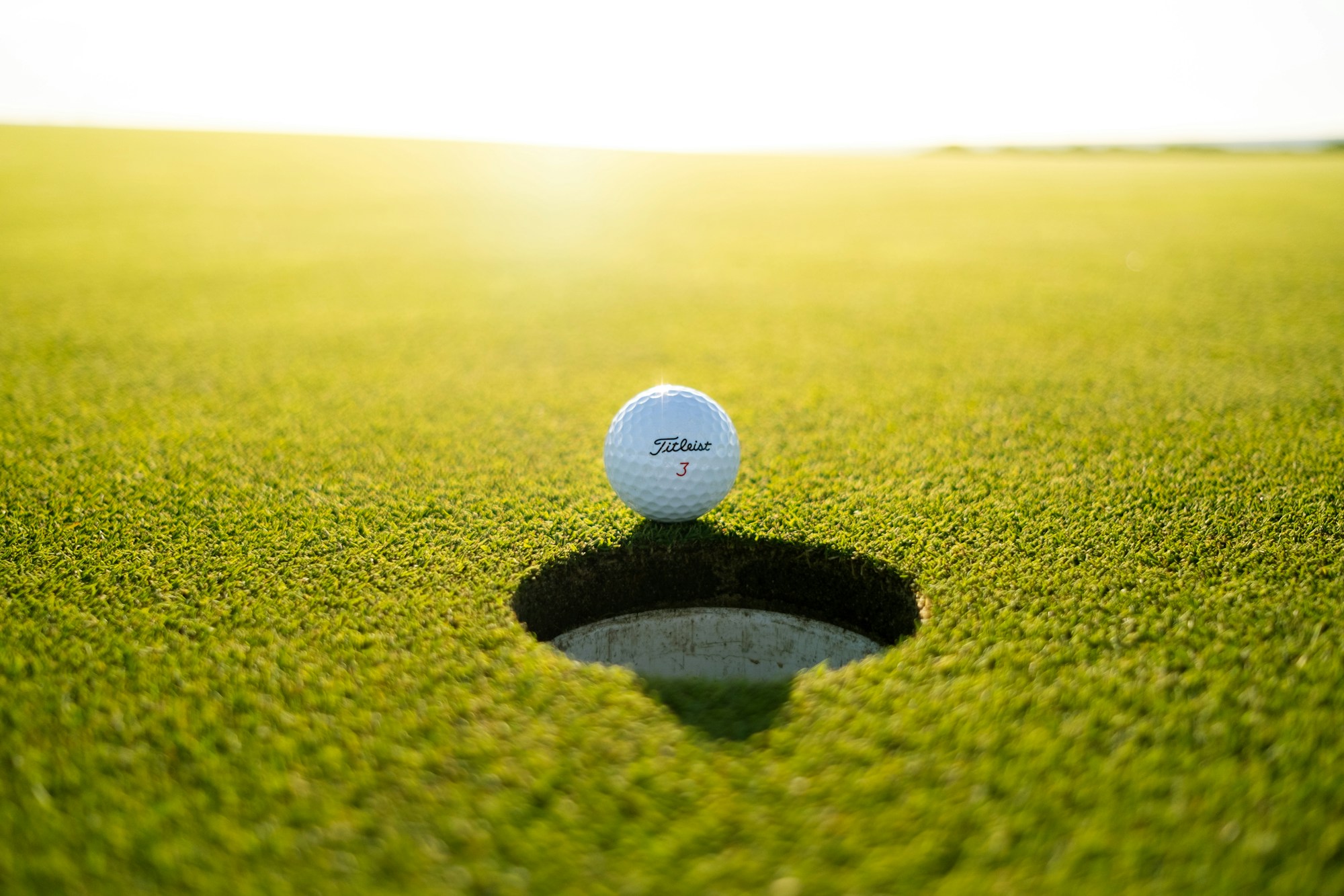 Golf ball on green grass